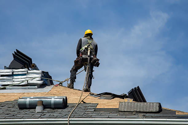 Professional Roof Replacement technician working in Inwood, NY